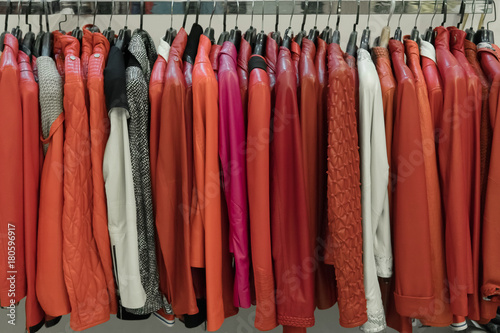 Rows of green and red leather jackets on the racks