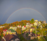 Double rainbow over the cottages. Russia, Sochi, Mamaika neighborhood