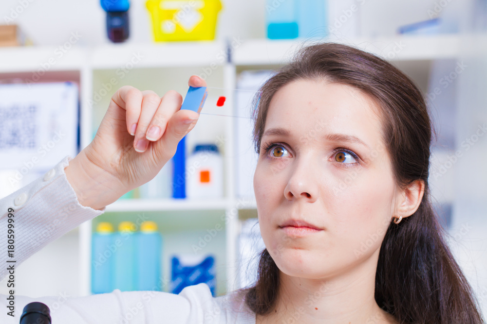 A girl technician in a medical laboratory