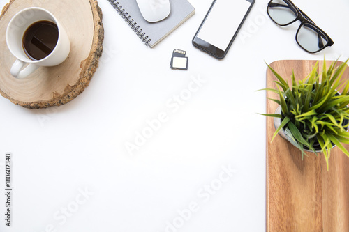 Desk table top overhead space design layout place phone ioslated for insert coffee cup with glasses plant upper wood photo