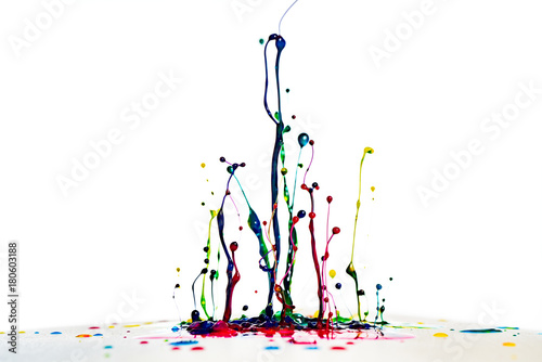 color dancing splashes of paint on a white background