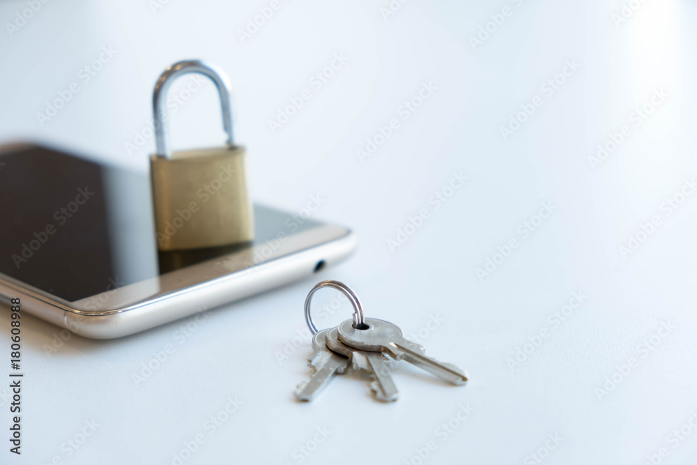 Telephone with lock, concept of protection of personal information. mobile phone security. chained smartphone. Security of smartphone. Low key lock, internet security smartphone data theft concept Telephone with lock, concept of protection of personal information. mobile phone security. chained smartphone. Security of smartphone. Low key lock, internet security smartphone data theft concept
