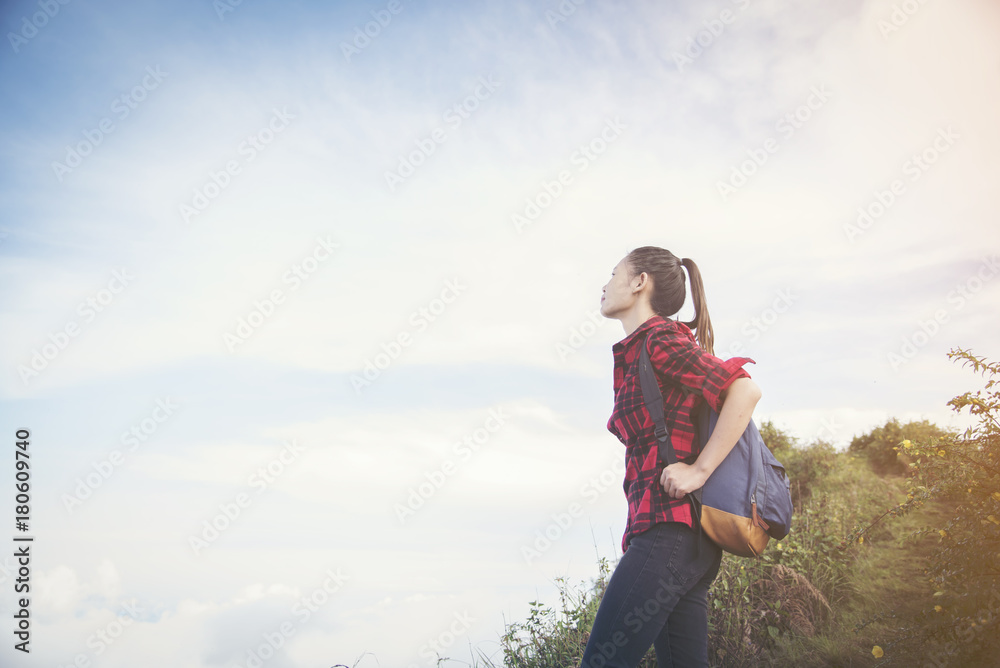 Man Traveler climbing on mountain summit over clouds Travel Lifestyle success concept adventure active vacations outdoor extreme sport Man Traveler climbing on mountain summit over clouds Travel Lifestyle success concept adventure active vacations outdoor extreme sport