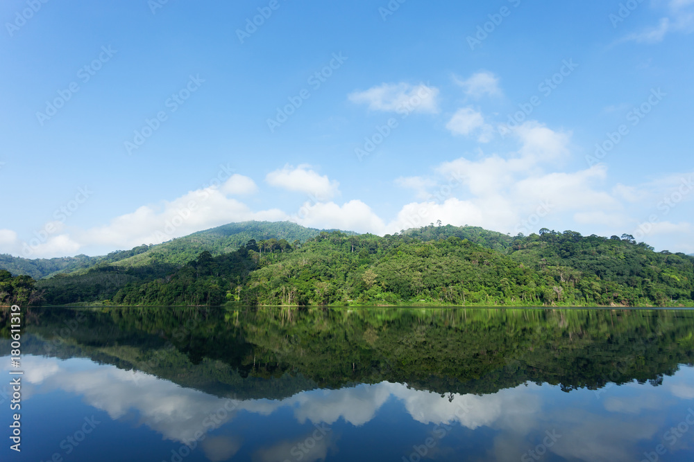 Mountain and Lake with reflex in the water scenery beautiful view with blue sky and clouds in phuket thailand.
