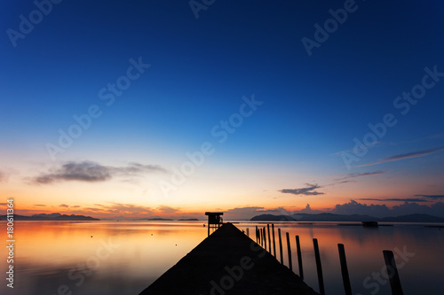 Fototapeta Naklejka Na Ścianę i Meble -  scenery view of old jetty to the sea beautiful sunrise or sunset in phuket thailand.