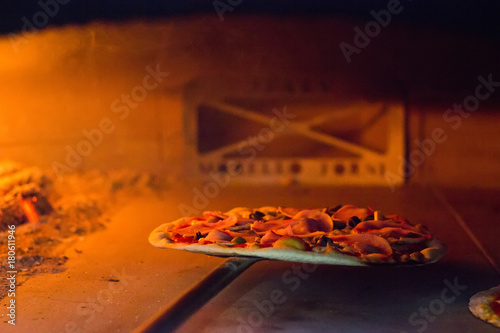 Fresh pizza inside the oven...