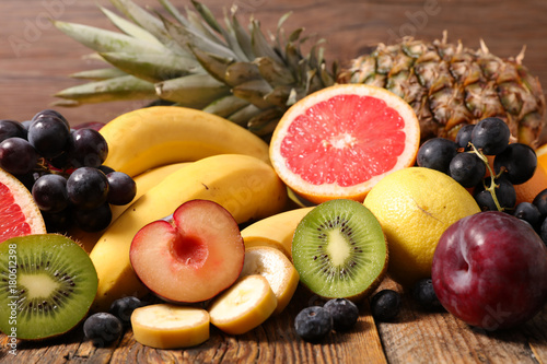 fresh fruits on wood background