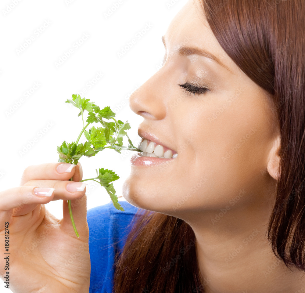 Cheerful woman eating potherbs, over white Cheerful woman eating potherbs, over white