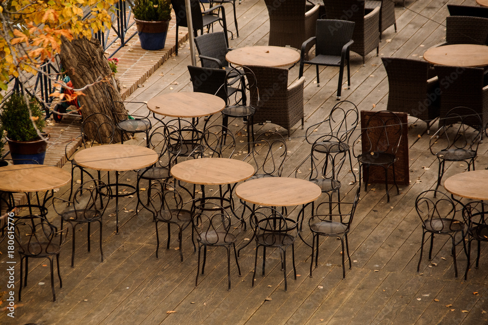 Old-fashioned empty outdoor cafe in European town