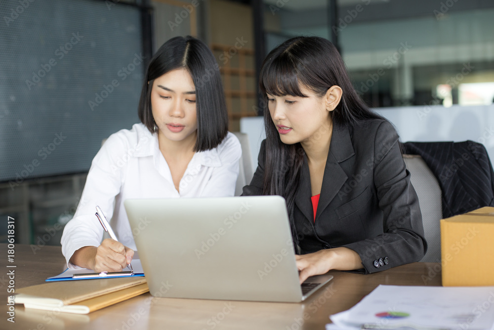 Young Asian Woman holding box with smiling together, Young Owner Woman Start up for Business Online, SME, Delivery Project, Woman with Online Business or SME Concept. Young Asian Woman holding box with smiling together, Young Owner Woman Start up for Business Online, SME, Delivery Project, Woman with Online Business or SME Concept.