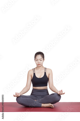 Portrait of young asian woman exercise playing yoga isolated white background