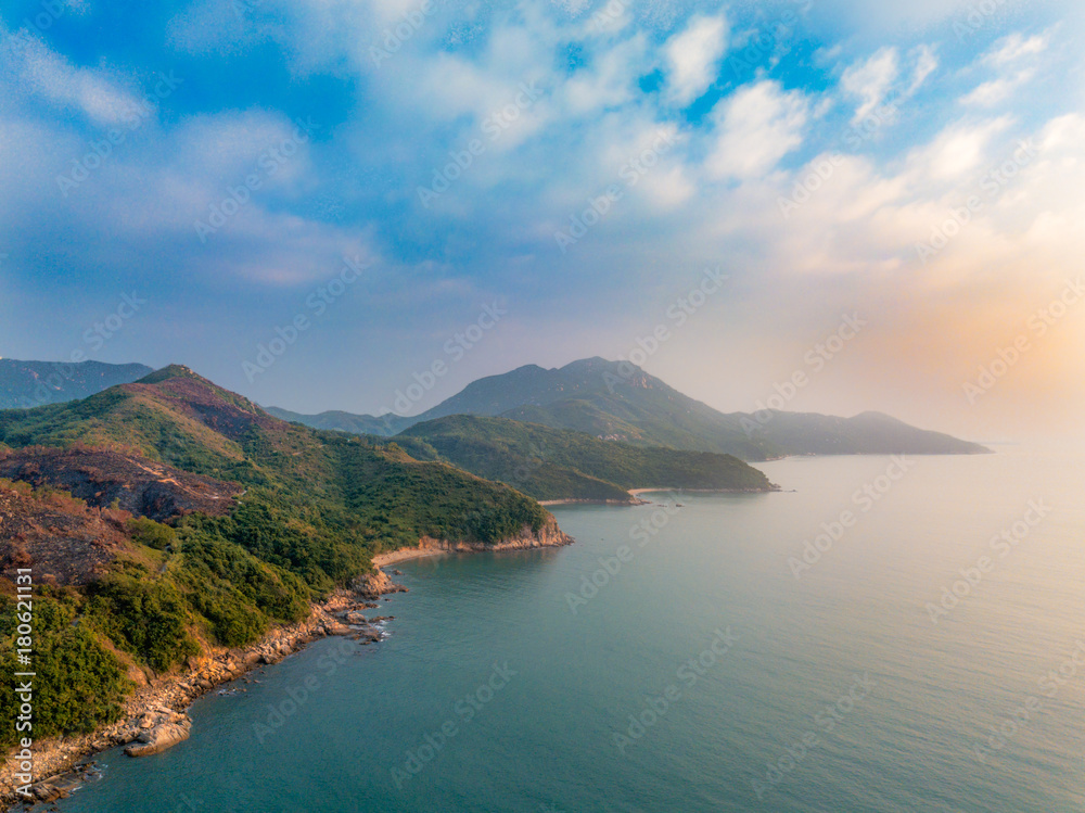 Aerial view of soft sea waves hitting rocks mountains and clear water amazing nature background Aerial view of soft sea waves hitting rocks mountains and clear water amazing nature background