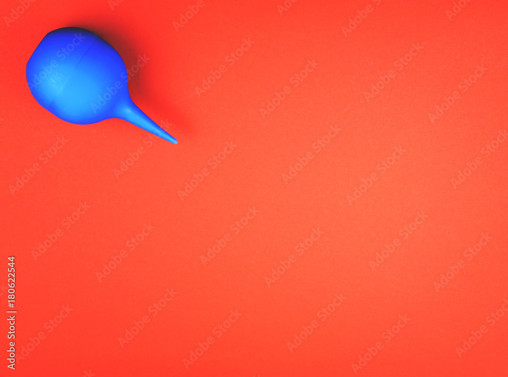 Blue enema on a colored background Blue enema on a colored background