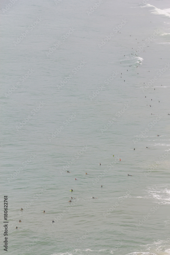 Surfers in Costao do Santinho beach Surfers in Costao do Santinho beach