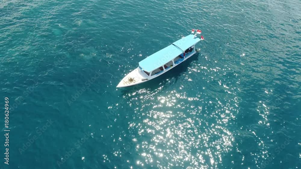 drone surrounding a boat on ocean water sunny 4k drone surrounding a boat on ocean water sunny 4k