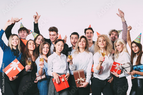 Group of people having a party with gift boxes.