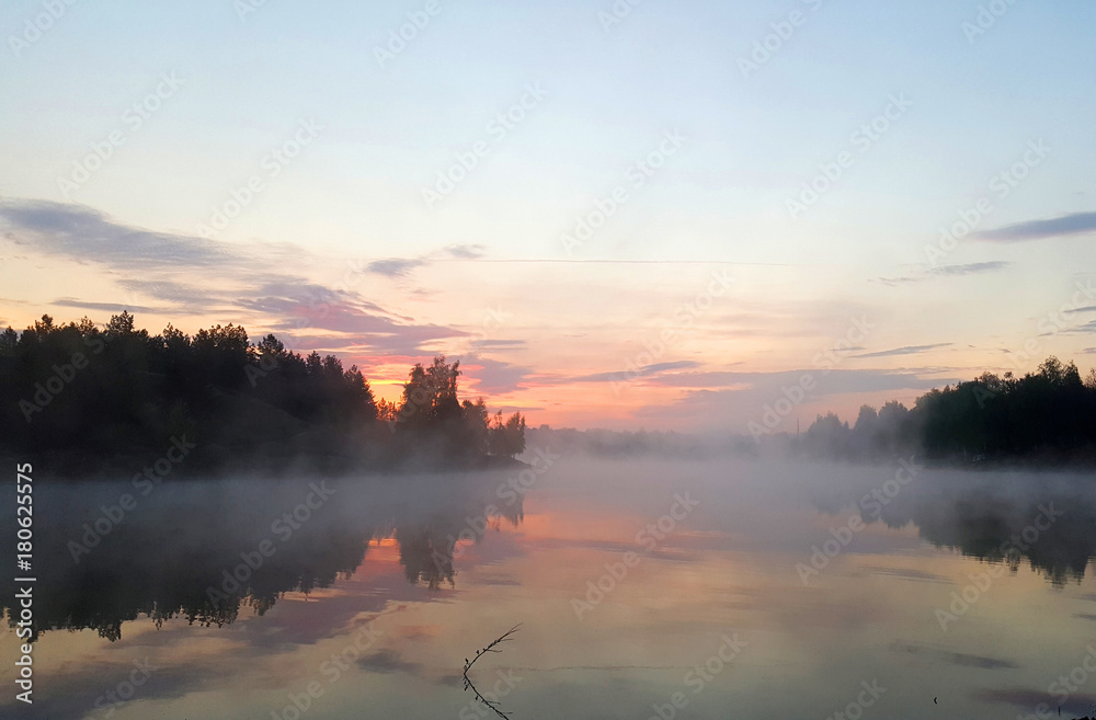 Foggy rising over the lake