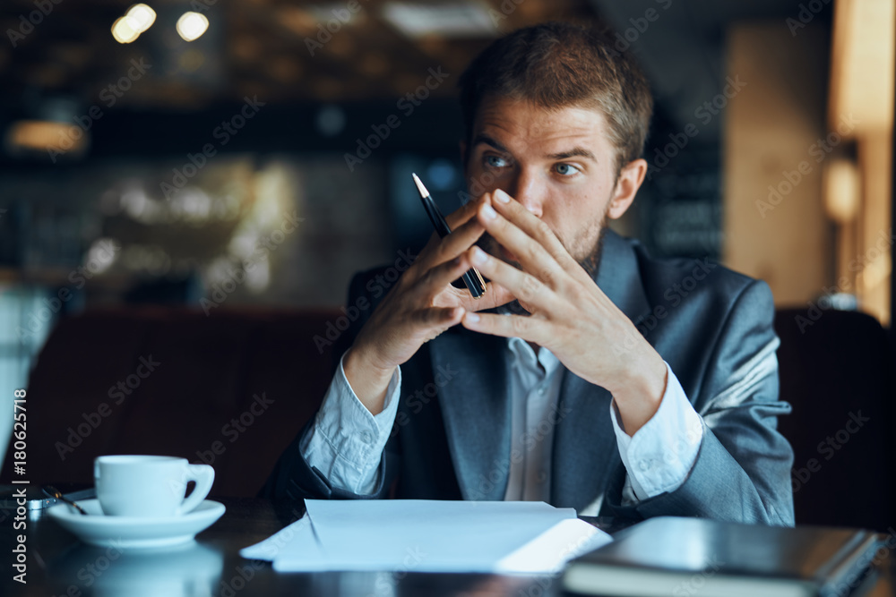 business man drinking coffee in a cafe