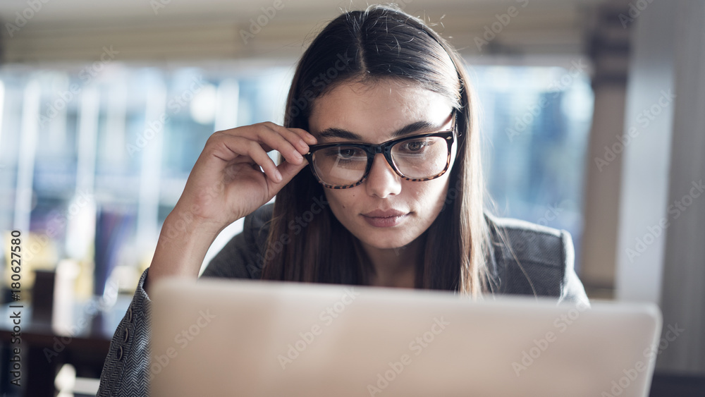 Businesswoman working in computer in office Businesswoman working in computer in office
