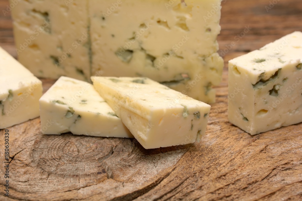  moldy blue cheese on wooden background