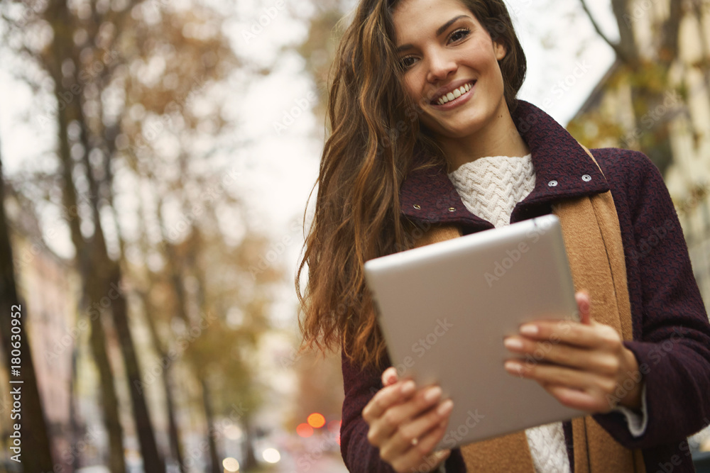Fototapeta premium Beautiful girl using a tablet