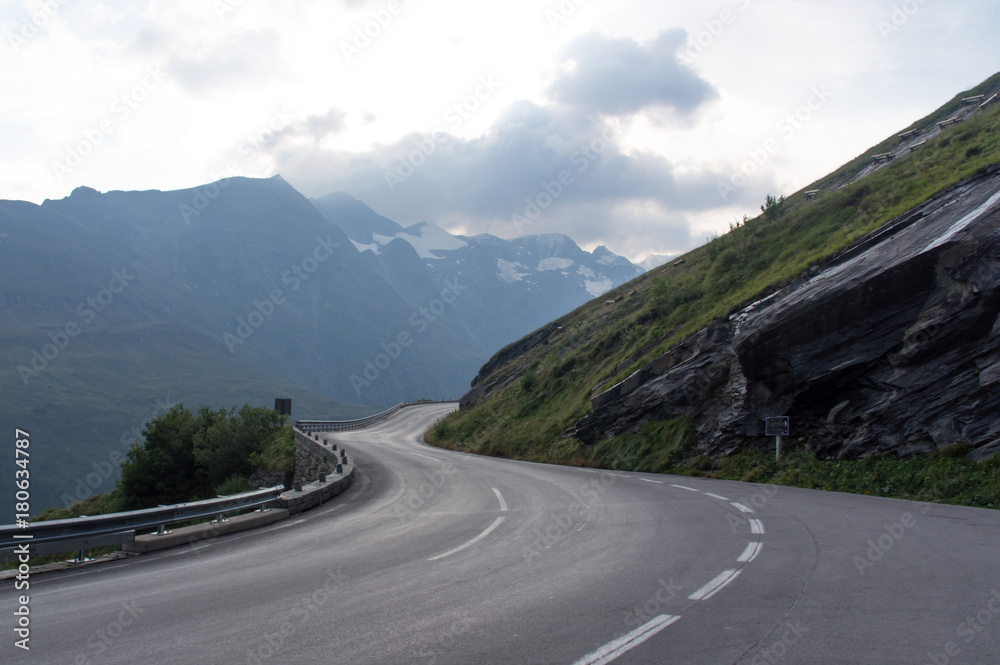 Naklejka premium Serpentine road and beautiful clouds high in the mountains, Austrian Alps, national road Grossglockner