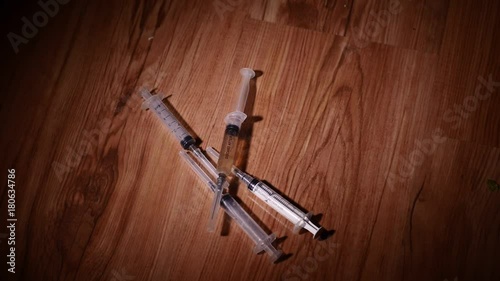 Falling syringes. Syringe drug abuse concept. Slow motion