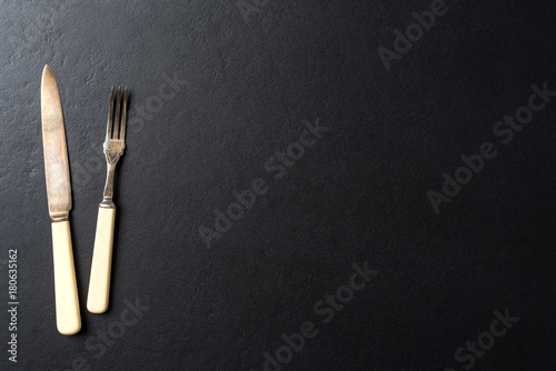 Kitchen utensils over black elegant background