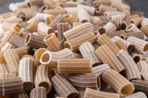 Italian raw colored whole wheat pasta photo