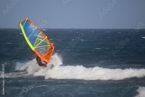 Windsurfer riding the waves of the atlantic ocean