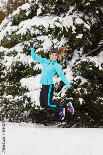 Winter sport, girl jumping in snow