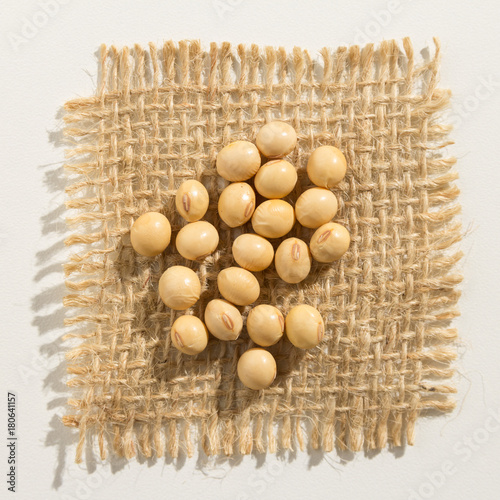 Soybean legume. Close up of grains over burlap. photo