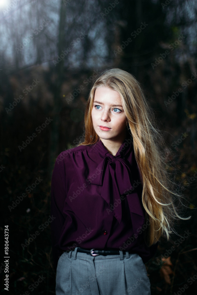 Blonde In Violet Blouse Posing In Forest. Retro clothes