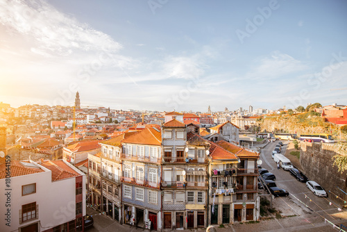 CItyscape view with beautiful old buildings during the sunset light in Porto city, Portugal