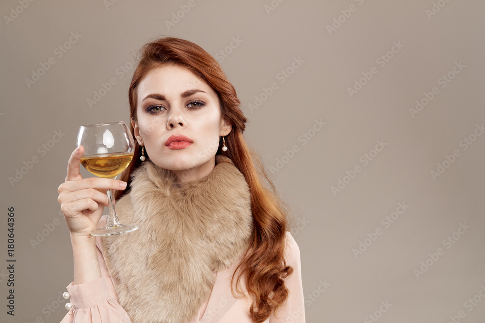 woman with a glass on a light background woman with a glass on a light background
