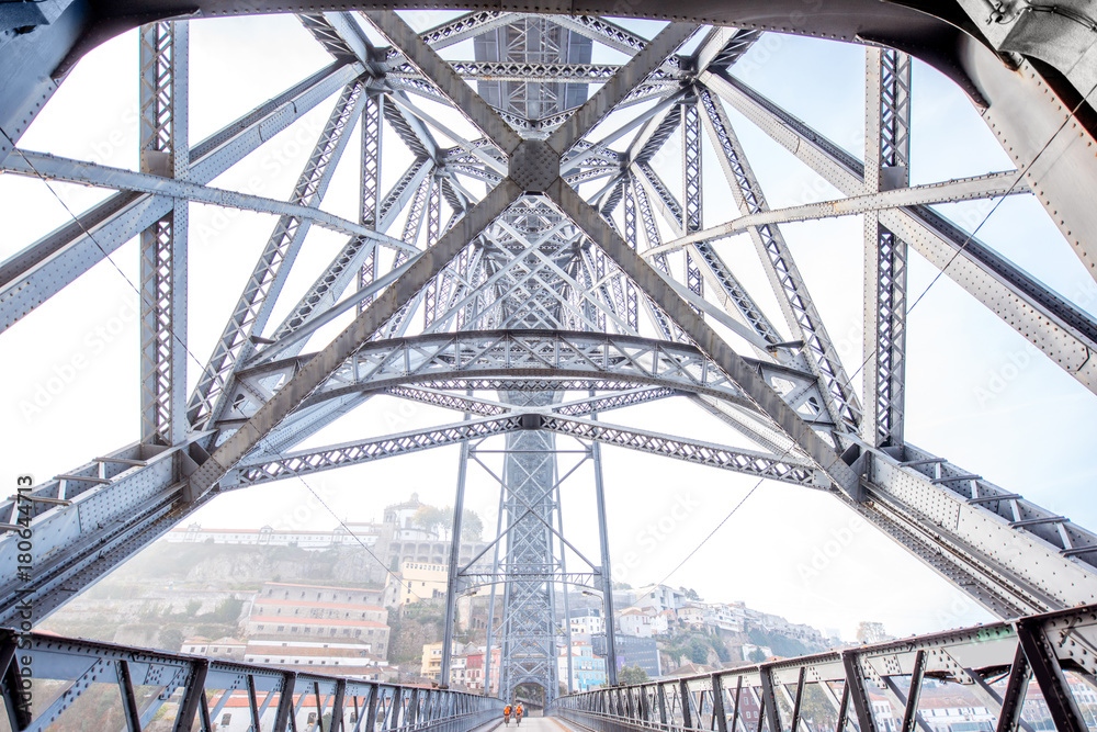 View from below on the famous Luis iron bridge during the morning light in Porto, Portugal