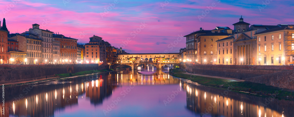 Panoramic view of River Arno and famous bridge Ponte Vecchio at sunset in Florence, Tuscany, Italy