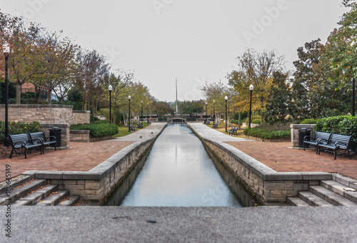 Waterway in park with benches