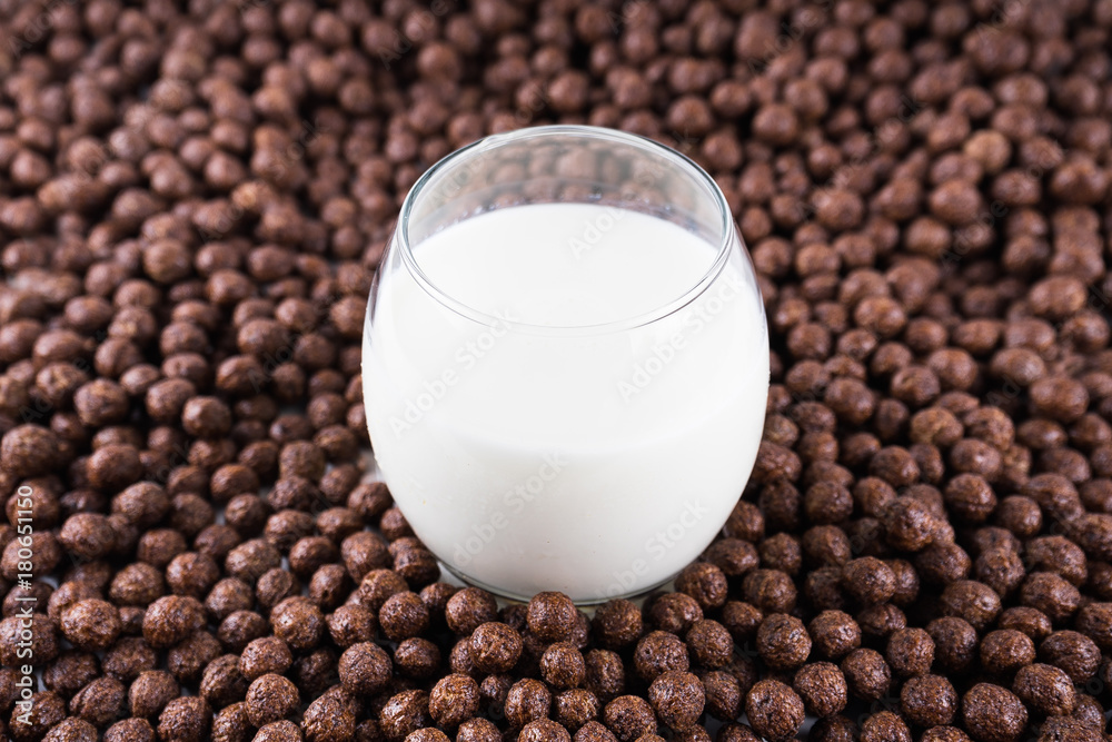 Breakfast in a glass of milk over muesli.