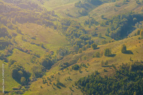 Nature Of Altai. The slopes of the mountains. The mountains in the fall. Autumn landscape. Trees on the hills.