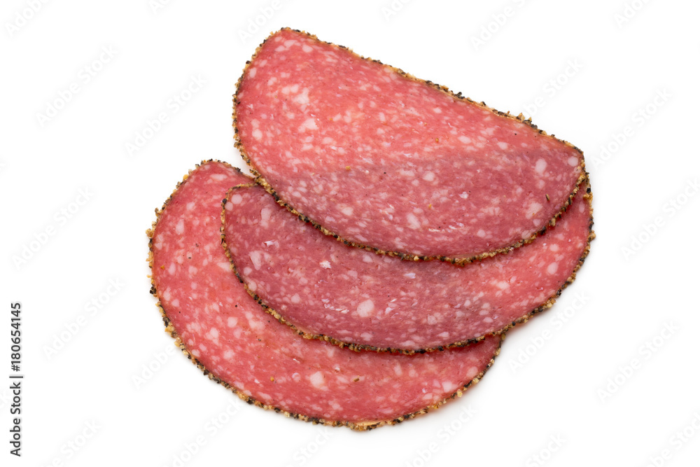 Salami slices isolated on the white background. Salami slices isolated on the white background.