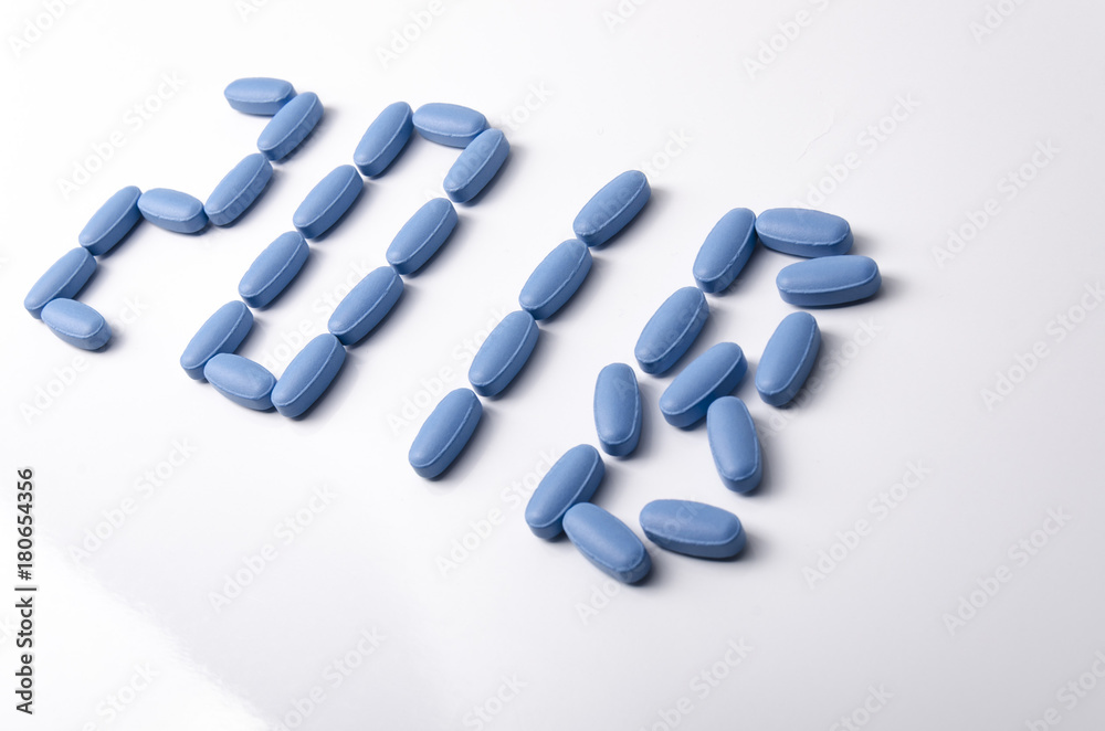 Creative 2018 new year concept made out blue medical tablets over a white background. Creative 2018 new year concept made out blue medical tablets over a white background.