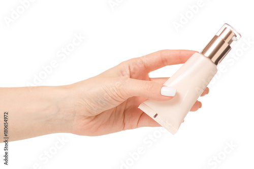 A female hand bottle of cream cosmetology © Kabardins photo