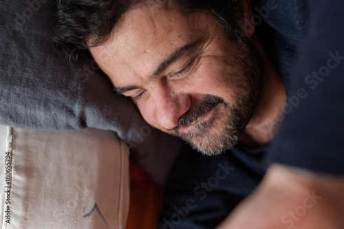 mid-adult man laying down