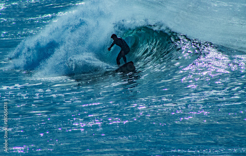 Surfer riding wave