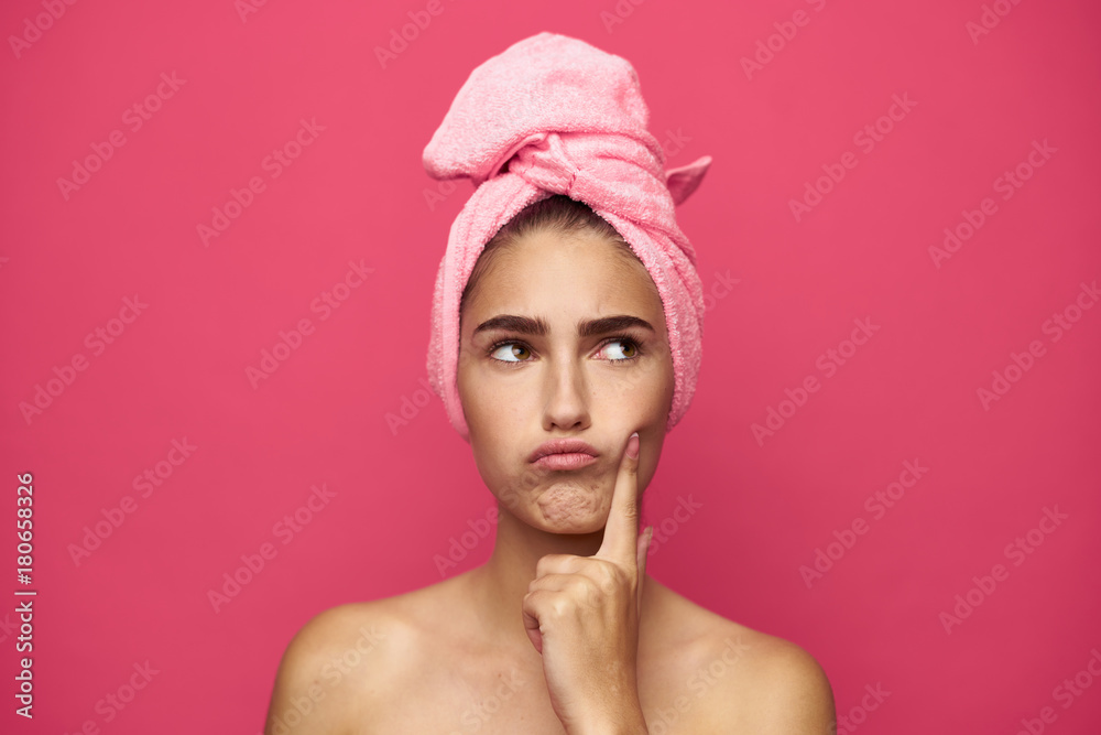 young woman with a towel on her head lost in thought young woman with a towel on her head lost in thought