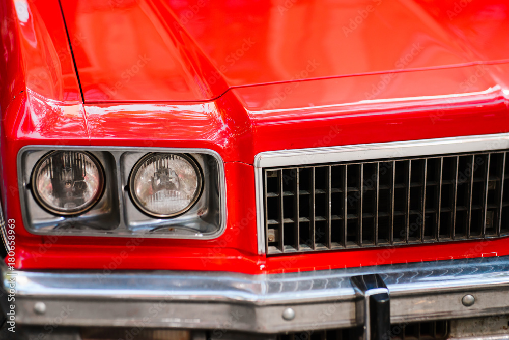 Close-up of headlights of red vintage car