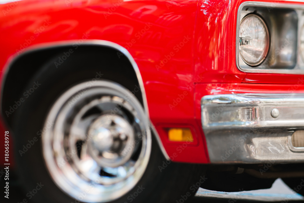 Close-up of headlights of red vintage car