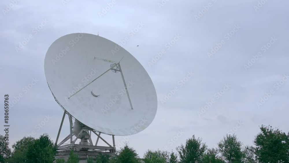 Long shot of the satellite array with trees Long shot of the satellite array with trees