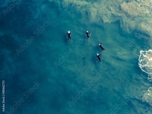 Surfers in the shallows